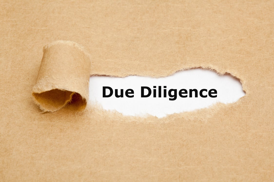 Due Diligence Risk Management Ripped Paper Concept